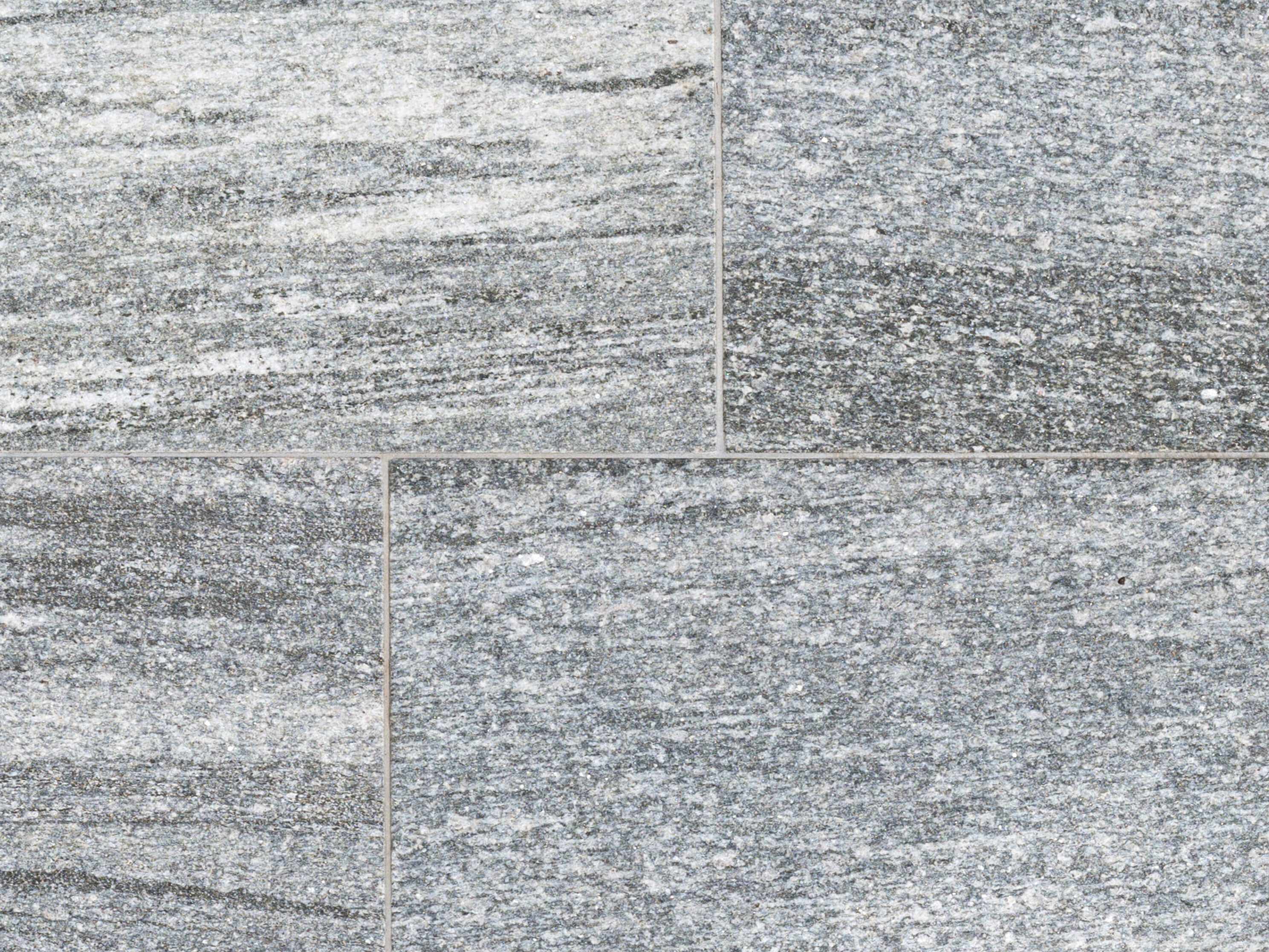 Mønstre fra mørkegrå toner til hvid. Nærbillede af Urban Grey Line grå granitplader