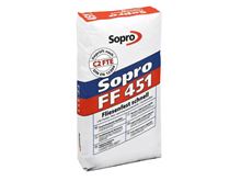 En pose grå fleksibel klæber til lægning af fliser